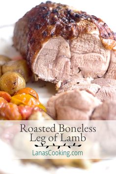 roasted boneless leg of lamb with roasted vegetables on the side and text overlay reading roasted boneless leg of lamb