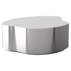 a round white table with chrome trim on the top and bottom, in front of a white background