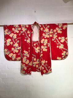 Circa 1920-30's Kinsha Silk  Haori (Red Silk Jacquard, Plum Blossom Pattern)  Hand made, hand sewn in Japan.  The jacket is crafted from kinsa(金紗), one of the highest quality silk jacquard textiles. It has a finer and smoother texture with more delicate shibo (the fabric's irregularities) compared to regular crepe with its soft and slightly shiny texture. Plum blossom represents strong perseverance, beauty, and hope for the New Year in Japanese kimono design. Period: Circa 1920-30's Material: Si Fitted Red Kimono For Spring, Vintage Fitted Kimono With Kimono Sleeves, Fitted Silk Kimono With Floral Print, Vintage Floral Print Kimono, Red Vintage Kimono For Spring, Traditional Fitted Kimono With Kimono Sleeves, Vintage Floral Print Kimono For Wedding, Vintage Spring Wedding Kimono, Vintage Red Kimono For Wedding