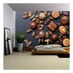 a bedroom with rocks on the wall and plants in vases next to it,