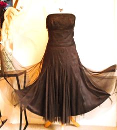 "A stunning dark brown evening strapless dress that combines 90's and 50's styles  Uk size 16 US 12 Bust 40 waist 34\" hips free  Length from underarm is 43\" so between mid calf and ankle depending on height Monsoon label -I can't find it in shops. Gothic elegance In good vintage condition.No faults to spoil it.Fully checked no cags in gauze. Strapless with fitted bust bones for support and lined.[Has strap option but sadly not supplied] Moulded bust with embroidery tape detail. 2 layers - unde Fitted Brown Strapless Dress For Party, Tea Length Corset Dress With Fitted Bodice For Evening, Brown Fitted Strapless Dress For Party, Evening Tea Length Corset Dress With Fitted Bodice, Evening Tea-length Corset Dress With Fitted Bodice, Fitted Tea Length Corset Dress For Party, Party Tea Length Fitted Corset Dress, Fitted Tea-length Strapless Dress For Party, Fitted Tea Length Strapless Dress For Party