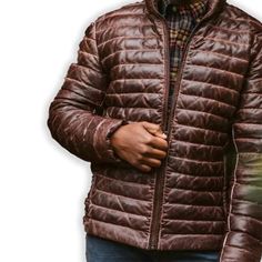 Rugged style meets winter warmth in our Men's Brown Leather Puffer Jacket. Crafted from supple, genuine leather with a rich brown hue, this jacket features quilted puffer insulation for superior heat retention. The classic silhouette is enhanced with a stand-up collar, zippered front, and snug cuffs to keep the cold at bay. Practical side pockets provide storage and hand-warming comfort. Perfect for the fashion-conscious man who doesn't compromise on functionality, this jacket seamlessly transitions from outdoor adventures to city streets. Key features: Premium brown sheepskin leather exterior for durability and style Quilted puffer design for superior insulation Adjustable hem to seal out cold air Multiple pockets for convenient storage Satin lining for a luxurious feel Premium YKK zipper