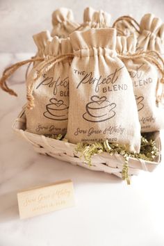 three bags of coffee sitting on top of a table next to a tag that says, the sweet blend blend