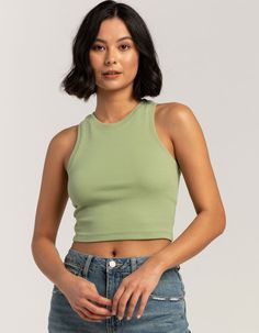 High Neck Tank. Solid Cotton Blend Tank Top With Stretch. Ribbed Knit Construction. High Neckline. Sleeveless. Fitted, Crop Silhouette. 57% Cotton/38% Polyester/5% Spandex. Hand Wash. Imported. Model Is Wearing A Size Medium. Model Measurements:height: 5'8" Bust: 32"waist: 25"hips: 36" | Tillys High Neck Tank Spring Green Tank Top With Seamless Construction, Green Seamless Tank Top For Spring, Green Stretch Vest, Green Racerback Top, Green Seamless Racerback Top, Casual Sleeveless Camisole With Seamless Construction, Casual Sleeveless Seamless Camisole, Casual Seamless Sleeveless Camisole, Trendy Sleeveless Top With Seamless Construction