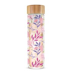 a pink and purple flowered glass bottle with bamboo lid is shown on a white background