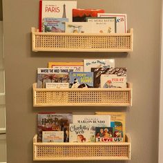 the bookshelves are organized with baskets to keep their children's books safe