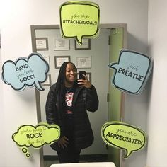 a woman taking a selfie in front of a mirror with speech bubbles above her