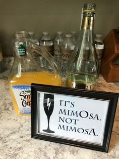 a framed sign that says it's mimosa not mimosa