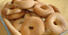 a pile of doughnuts sitting in a glass dish