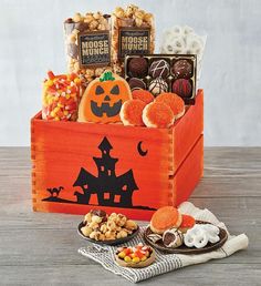 a wooden box filled with halloween treats