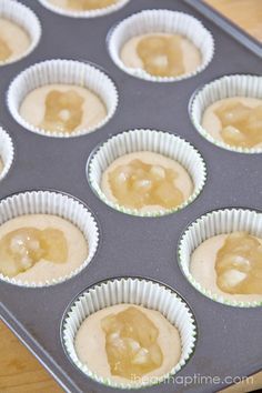 some cupcakes that are sitting in a muffin tin