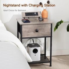 a night stand with charging station on it next to a bed