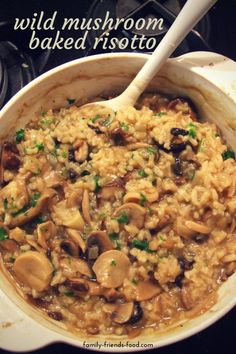 mushroom risotto with parsley in a skillet on top of the stove