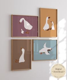 three framed pictures hanging on the wall with ducks and geese in different colors, including brown, pink, blue, orange