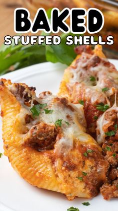 baked stuffed shells on a white plate with parsley