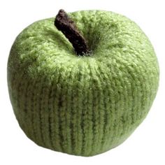 an apple that is green and has a brown piece in it's center, on a white background