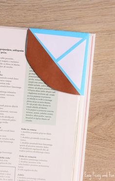 an open book sitting on top of a wooden table