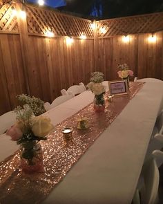 the table is set up with flowers and candles