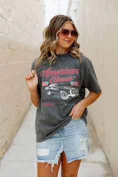 Experience timeless style with our AMERICAN CLASSIC OVERSIZED VINTAGE WASH TEE. Made with quality materials and featuring an oversized fit, this tee combines comfort and fashion. Its vintage wash adds a unique touch to your wardrobe, making it a must-have for any fashion-forward individual. Gray Washed Graphic Tee T-shirt, Gray Soft-washed Graphic Tee, Vintage Gray T-shirt With Text Print, Casual Distressed Gray Tops, Retro Gray Cotton Tops, Gray Retro Cotton Top, Retro Gray T-shirt With Letter Print, Gray Vintage Relaxed Fit Tops, Vintage Gray Summer T-shirt