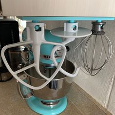 a blue mixer sitting on top of a counter