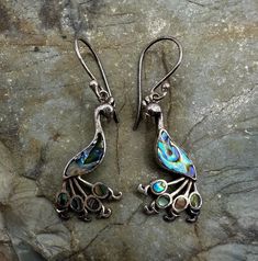 "Sterling Silver and Abalone Peacock Dangle Drop Earrings 1.5\". Marked 925. Condition is good, light tarnish, scuffs and scratches. Thank you for looking! Prices on shop items are fair and reasonable, so all prices are firm.  No reserves, all items sold as-is. Please review photos and description carefully before purchasing.  Please let me know of you have any questions or special shipping requests such as postal insurance.  We are a licensed gold and silver buyer in the state of California; al Elegant Sterling Silver Earrings With Peacock Design, Silver Dangle Jewelry With Peacock Design, Silver Earrings With Peacock Design As A Gift, Gift Silver Earrings With Peacock Design, Silver Peacock Design Earrings, Silver Peacock Design Earrings Gift, Silver Peacock Design Earrings As Gift, Gift Peacock Design Dangle Earrings, Peacock Design Dangle Earrings For Gift