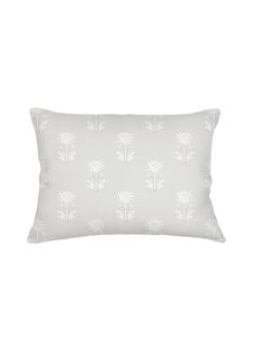 a white pillow with trees on it