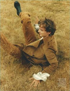 a man sitting on the ground with his foot up