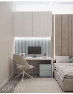 a bedroom with a bed, desk and computer monitor on the wall next to it