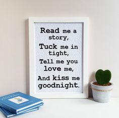 a framed book page with the words read me a story, tuck me in tight, tell me you love me and kiss me good night