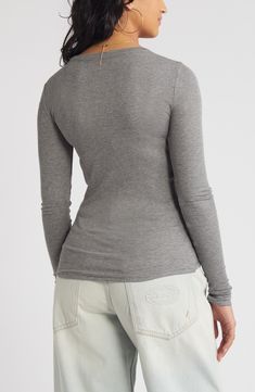 A stretchy rib knit perfects the figure-hugging fit of this lithe, long-sleeve T-shirt. 25 1/2" length (size Medium)   Crewneck   Long sleeves   97% Lenzing™ EcoVero™ viscose, 3% spandex   Lenzing EcoVero viscose is a sustainably produced fiber using pulp made from renewable wood sources and certified with the EU Ecolabel for high environmental standards, including lower emissions and water usage than generic viscose   Hand wash, dry flat   Imported   Not available for sale and shipment to Germa Stretch Ribbed Long Sleeve Top For Layering, Winter Fitted Top With Thumbholes, Fitted Winter Top With Thumbholes, Fitted Ribbed Long Sleeve T-shirt, Stretch Ribbed Gray Tops, Fitted Long Sleeve Ribbed T-shirt, Solid Ribbed Fitted Long Sleeve Top, Ribbed Fitted Long Sleeve Top, Ribbed Stretch Long Sleeve Top With Crew Neck