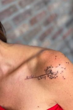 a woman with a dandelion tattoo on her shoulder