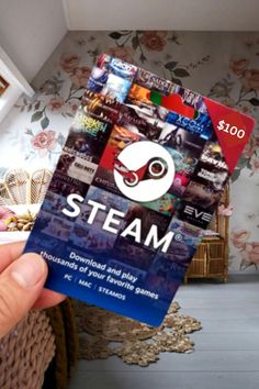 a person holding up a card with the word steam on it