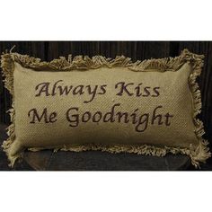 a pillow that says, always kiss me goodnight