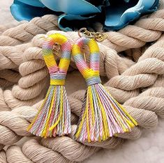 ✨️FREE SHIPPING (USPS First-Class Mail) and will ship out in ONE Business Day ✨️ "Vibrant Striped Tassel Earrings: A Spring/Summer Symphony of Color" Step into the bright side of fashion with our Vibrant Striped Tassel Earrings, tailored perfectly for the Spring and Summer seasons. Swirling in a harmonious yellow, blue, and pink blend, each tassel tells a story of vibrant sunsets, clear blue skies, and blooming flowers. Handcrafted with precision, these earrings exhibit the elegance of simplicit Handmade Multicolor Earrings For Beach, Yellow Bohemian Tassel Earrings For Beach, Yellow Tassel Earrings For Beach, Handmade Rainbow Earrings For The Beach, Multicolor Tassel Earrings For Summer Beach, Multicolor Spring Tassel Dangle Earrings, Multicolor Dangle Tassel Earrings For Spring, Multicolor Tassel Earrings For Beach In Spring, Adjustable Rainbow Earrings For Beach