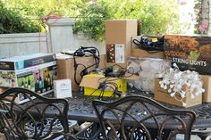 the table is covered with boxes and other items