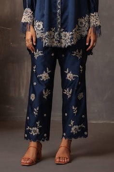 Dark blue shirt with thread embroidery in floral applique cutwork border. Paired with cutwork border embroidered narrow pant. - Aza Fashions Elegant Straight Pants With Embroidered Border, Embroidered Straight Pants For Eid, Eid Embroidered Straight Pants, Straight Pants With Embroidered Border For Eid, Eid Straight Pants With Embroidered Border, Eid Embroidered Border Straight Pants, Elegant Cotton Bottoms With Floral Embroidery, Elegant Bottoms With Embroidered Border For Eid, Elegant Embroidered Eid Bottoms