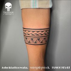 a man's leg with a tattoo on it and an arrow in the middle