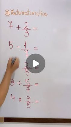 a person writing on a white board with numbers