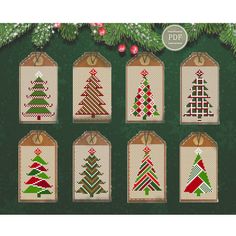 cross stitch christmas tree tags on a green background