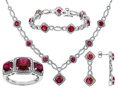 18.39ctw Square Cushion Lab Ruby And 0.02ctw Round White Diamond Rhodium Over Brass Necklace, Bracelet, Ring And Earring Jewelry Set. Necklace Measures Approximately 18"L x 0.99"W With Lobster Clasp Closure. Bracelet Measures Approximately 7.25" x 0.42"W With Hidden Box Clasp Closure And Safety Lock. Ring Measures Approximately 0.89"L x 0.44"W. Not Sizeable. Dangle Earrings Measure Approximately 1.25"L x 0.43"W With Pushbackings. Formal Ruby Gemstones, Luxury Ruby Jewelry With Pave Setting, Red Oval Jewelry With Pave Setting, Oval Red Jewelry With Pave Setting, Fine Jewelry Cubic Zirconia Gemstones For Formal Occasions, Hand-set White Gold Jewelry In Platinum, Hand-set Platinum Jewelry In White Gold, Formal Fine Jewelry With Cubic Zirconia Gemstones, Dazzling Formal Jewelry With Prong Setting