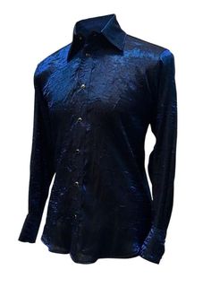 "A classic cut men's shirt with flash! Comfortable, light-weight dark blue shimmer fabric adds a lot of style to a traditional cut. A generous, slimming fit fastened with rich black pearl snaps down front and at cuffs. Definitely will make you stand out in a crowd. Comes in sizes small-XXL. These shirts are large and drapey. Order a size smaller than what you usually wear. Check the measurements below. Measurements: Small: Chest 46\" Waist 42\" Medium: Chest 49\" Waist 44\" Large: Chest 52\" Wai Shimmer Fabric, Bespoke Post, Mens Flannel Shirt, Cotton Polo Shirt, Mens Costumes, Black Pearl, Polo Ralph Lauren Mens, Online Shopping Stores, Blue Shirt