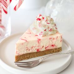 a slice of peppermint cheesecake on a plate with a fork