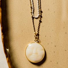 The full moon is both enchanting and sparks our imagination and creativity with its bright glow. Here, a carved amulet with Mother of Pearl showcases a serene face of the full moon. We've combined this with 2 layers of our faceted chain that gives the most beautiful sparkle like twinkling stars. The back of the necklace has a 2 inch extension to allow flexibility in the length. ⬩20mm Round Moon shape⬩18 inch Plated Double Chain necklace⬩Mother of Pearl is said to provide soothing protection from Mother Moon, Gold Moon Necklace, Double Chain Necklace, Twinkling Stars, Moon Shape, Twinkle Star, The Full Moon, Gold Moon, Moon Shapes