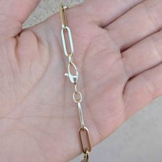 "Our best-selling 14k/18k gold rectangular flat paperclip chain in our biggest size: Extra Large. Choose from 14k/18k yellow, rose and white gold, as well as five different standard lengths (or contact us for a custom length). Layer two or three of our chains for the #neckmess look that is so hot right now! If you are interested in 18k gold, please contact us for a quote. Our rectangular flat paperclip chain comes in: Bracelet: https://etsy.me/2X6jSqM Extra Small: https://etsy.me/318xBN0 Small: 14k Gold Rectangular Paperclip Chain Bracelet, Gold Rectangular Paperclip Bracelet With Lobster Clasp, Modern 14k Gold Paperclip Bracelet With Gold Chain, 14k Gold Paperclip Bracelet With Lobster Clasp, Modern 14k Gold Paperclip Bracelet With Lobster Clasp, Formal Paperclip Bracelet With Lobster Clasp, Modern Jewelry With Rectangular Paperclip Chain, 14k Gold Link Bracelet With Gold Chain, Modern 14k Gold Rectangular Paperclip Bracelet