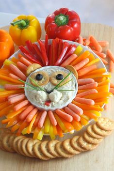 a lion face made out of carrots and crackers