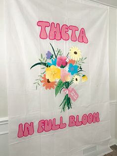 a white shower curtain with flowers on it and the words,'there is in full bloom '