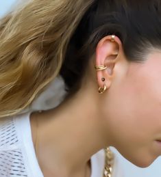 "Twisted wire ear cuff ✦ Get the look of a cartilage hoop, no piercing required! Sold in a qty of 1 14k gold filled ( tarnish proof ) 16 gauge thickness 10 mm diameter Easily molds to fit your ear Wear it all the time! No need to remove when you shower or sleep, it's comfortable and tarnish resistant. Stacks perfectly with this ear cuff: https://www.etsy.com/listing/694562054/ear-cuff-ear-cuff-no-piercing-hammered?ref=shop_home_active_2&crt=1 ------------------------ Please allow 2-3 busines Trendy Gold-plated Yellow Gold Ear Cuff, Dainty 14k Gold Ear Cuff For Everyday, Everyday 14k Gold Hypoallergenic Ear Cuff, Hypoallergenic 14k Gold Ear Cuff For Everyday, Gold 14k Ear Cuff For Pierced Ears, Minimalist Gold Plated Huggie Ear Cuff, Dainty 14k Gold Hypoallergenic Ear Cuff, Gold 14k Single Ear Cuff, Single 14k Gold Ear Cuff