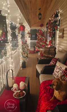 a porch decorated for christmas with lights and decorations