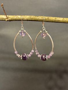 These are one of kind beautiful handmade lavender and dreamy amethyst gemstone dangle chandelier earrings. Earrings have sterling silver tubes and a 8 mm faceted lavender crystal. Closing with sterling silver leverbacks. Total measurement is 2 1/2 inches including the Sterling silver lever back earring wire. Handmade Chandelier Earrings, Handmade Chandelier, Earring Wire, Amethyst Gemstone, Chandelier Earrings, Beading, Lavender, Amethyst, Jewelry Earrings