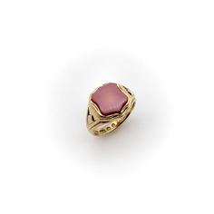 This is part of Chairish’s Fine Jewelry assortment.  The banded agate in this 15k gold Victorian signet ring was left uncarved—allowing the agate’s beauty to be the centrepiece of the ring. The surface layer of the stone is a lavender purple-grey. Beneath it is a carnelian-coloured amber red that is revealed on the back and sides of the stone. The ring’s setting is open on the bottom and the stone is translucent when held up to the light; because of this, it glows when worn. The signet is shield Formal Carnelian Signet Ring With Polished Finish, Luxury Carved Yellow Gold Signet Ring, Classic Carnelian Signet Ring For Formal Occasions, Classic Carnelian Signet Ring For Formal Events, Elegant Carved Signet Ring For Formal Occasions, Oval Agate Signet Ring With Polished Finish, Luxury Carnelian Ring For Formal Occasions, Elegant Carved Round Signet Ring, Elegant Carved Agate Jewelry